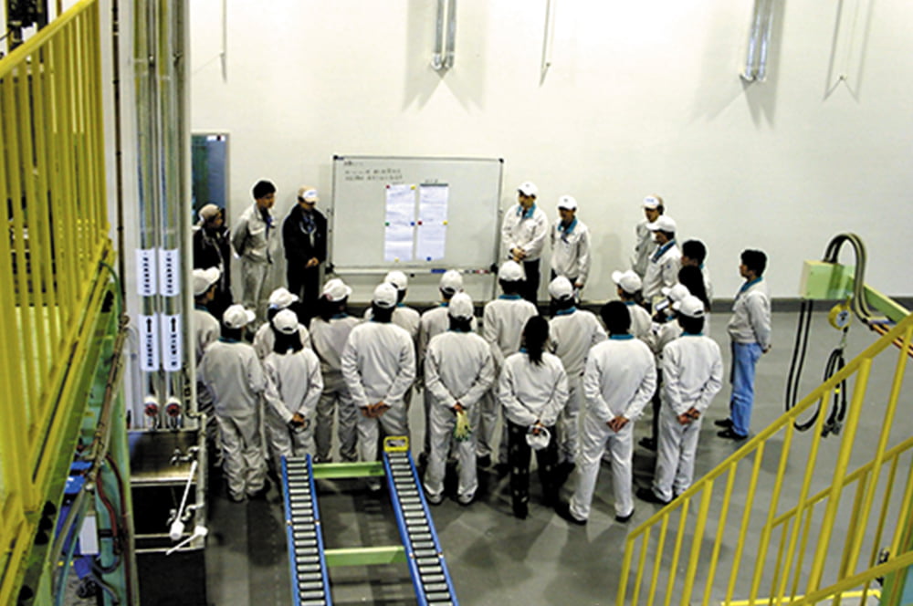 Morning assembly and training scene on the first day of mass production of CCC